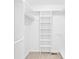 A bright, walk-in closet with adjustable shelving units for organized storage at 2041 Jefferson Ave, Gastonia, NC 28056