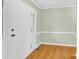 Inviting entryway featuring wood floors, a white front door, and a sidelight window at 2041 Jefferson Ave, Gastonia, NC 28056