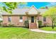 Charming brick home featuring a welcoming front porch and well-maintained landscaping at 2041 Jefferson Ave, Gastonia, NC 28056
