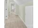 Hallway with neutral carpet and a white storage cabinet at 2041 Jefferson Ave, Gastonia, NC 28056