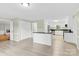 Open-concept space featuring a modern white kitchen with granite countertops and stainless steel appliances at 2041 Jefferson Ave, Gastonia, NC 28056