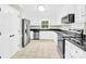 Bright kitchen with stainless steel appliances, white cabinets and granite countertops at 2041 Jefferson Ave, Gastonia, NC 28056