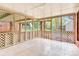 Spacious screened-in porch with tile flooring and lattice, perfect for outdoor relaxation and entertaining at 2041 Jefferson Ave, Gastonia, NC 28056