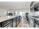 Contemporary kitchen featuring granite countertops, stainless steel appliances, and an island at 2071 Gum Ln, Concord, NC 28025