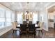 Well-lit dining room with a modern chandelier, spacious table, and beautiful decor at 2526 Fort St, Charlotte, NC 28205