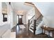 Elegant foyer with hardwood floors, staircase, and ample natural light, creating a grand entrance at 2526 Fort St, Charlotte, NC 28205