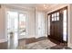 Welcoming foyer features hardwood floors, a stylish pendant light, and a view to the living spaces at 2526 Fort St, Charlotte, NC 28205
