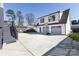 Exterior view of the garage with basketball hoop and large driveway at 2526 Fort St, Charlotte, NC 28205