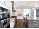 Modern kitchen with stainless steel appliances, granite countertops, and ample cabinet space at 2526 Fort St, Charlotte, NC 28205