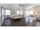 Spacious primary bedroom features high ceilings, elegant furnishings, and dark hardwood floors with ample natural light at 2526 Fort St, Charlotte, NC 28205