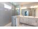 A sleek bathroom features double sinks, modern lighting, and a glass-enclosed shower at 2551 Barry St, Charlotte, NC 28205