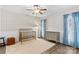 Cozy bedroom featuring a crib, dresser, and soft blue curtains at 279 Farm Estates Dr, Rockwell, NC 28138