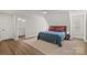 Bright bedroom featuring wood floors, a neutral color palette, and an ensuite bathroom at 279 Farm Estates Dr, Rockwell, NC 28138