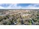 Downtown landscape featuring commercial buildings, churches, and residential areas under a bright sky, capturing the town's essence at 305 S Clay St, Gastonia, NC 28052