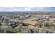 Suburban area showcasing residential homes, schools, and recreational fields with a lush tree canopy and mountain backdrop at 305 S Clay St, Gastonia, NC 28052