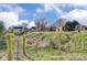 View of the backyard with houses in the distance and a fence at 305 S Clay St, Gastonia, NC 28052