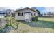 Charming home with vinyl siding, blue shutters, and a manicured lawn at 305 S Clay St, Gastonia, NC 28052