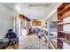 Spacious garage with ample storage shelves, a tile floor and work benches at 305 S Clay St, Gastonia, NC 28052