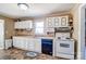 Efficient kitchen featuring white cabinetry, good counter space, and modern appliances at 305 S Clay St, Gastonia, NC 28052