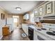 Functional kitchen with white cabinets, ample counter space, and essential appliances at 305 S Clay St, Gastonia, NC 28052