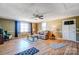 Spacious living room with hardwood floors, ceiling fan, and cozy furniture arrangement at 305 S Clay St, Gastonia, NC 28052