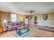 Cozy living room featuring hardwood floors, a comfortable couch, and easy access to other rooms at 305 S Clay St, Gastonia, NC 28052