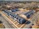 Aerial view of residential homes featuring on-site parking, landscaping, and architectural details at 330 Malvern Sw Ave # B, Concord, NC 28025