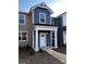Charming two-story townhome with covered entry, manicured landscaping, and appealing exterior finishes at 330 Malvern Sw Ave # B, Concord, NC 28025