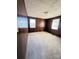 Comfortable bedroom featuring wood paneled walls, carpet, and natural light at 3412 1St Avenue Nw Cir, Hickory, NC 28601