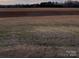 Expansive view of the open field, showcasing the potential of the property's land at 3412 1St Avenue Nw Cir, Hickory, NC 28601