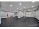Bright basement boasting durable flooring, recessed lighting, with both a storage room and a garage access at 411 Belo Ct, Fort Mill, SC 29715