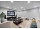 This finished basement has recessed lighting and a cozy sitting area with a large screen television and comfortable furnishings at 411 Belo Ct, Fort Mill, SC 29715