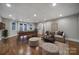 Finished basement with a pool table, comfortable seating and large windows for ample natural light at 411 Belo Ct, Fort Mill, SC 29715
