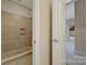 A tiled walk-in shower has a built-in bench and is viewed from an open door at 411 Belo Ct, Fort Mill, SC 29715