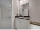Bathroom featuring granite vanity with white cabinets and modern fixtures, viewed from doorway at 411 Belo Ct, Fort Mill, SC 29715