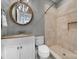 Bathroom featuring a vanity with a decorative mirror and tiled shower with built-in shelving at 411 Belo Ct, Fort Mill, SC 29715