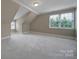 Neutral bedroom featuring vaulted ceilings, plush carpeting, and natural light at 411 Belo Ct, Fort Mill, SC 29715