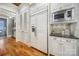 Gourmet kitchen boasts built-in refrigerator and microwave, granite countertops, and ample storage at 411 Belo Ct, Fort Mill, SC 29715