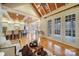 Open-concept living space with hardwood floors, vaulted ceiling, and access to outdoor deck at 411 Belo Ct, Fort Mill, SC 29715