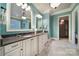 Luxurious bathroom with double vanities, granite countertops, and decorative mirrors at 411 Belo Ct, Fort Mill, SC 29715