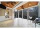 Covered porch with tile flooring, ceiling fans, and views of the trees at 411 Belo Ct, Fort Mill, SC 29715