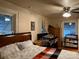 Main bedroom featuring a bed with soft bedding, natural light, and baby furniture at 412 Miles Rd, Shelby, NC 28150