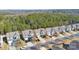 Aerial view of neighborhood homes and a large wooded area at 4462 Haddington Dr, Fort Mill, SC 29707