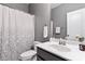 Well-maintained bathroom with a shower featuring a patterned curtain and single sink at 4462 Haddington Dr, Fort Mill, SC 29707