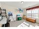 Light-filled bedroom with neutral walls and large windows used as an art studio with painting supplies at 4462 Haddington Dr, Fort Mill, SC 29707