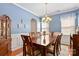 Formal dining room showcasing a large table, chandelier, and blue walls with classic trim at 4462 Haddington Dr, Fort Mill, SC 29707