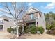 Two-story home featuring brick and vinyl siding, surrounded by mature trees at 4462 Haddington Dr, Fort Mill, SC 29707