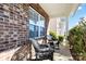 Inviting front porch features wicker rocking chairs and brick facade at 4462 Haddington Dr, Fort Mill, SC 29707