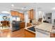 Open kitchen with stainless steel appliances, granite countertops, and hardwood floors at 4462 Haddington Dr, Fort Mill, SC 29707