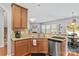 Well-lit kitchen area featuring stainless steel appliances, granite counters, and wooden cabinets at 4462 Haddington Dr, Fort Mill, SC 29707